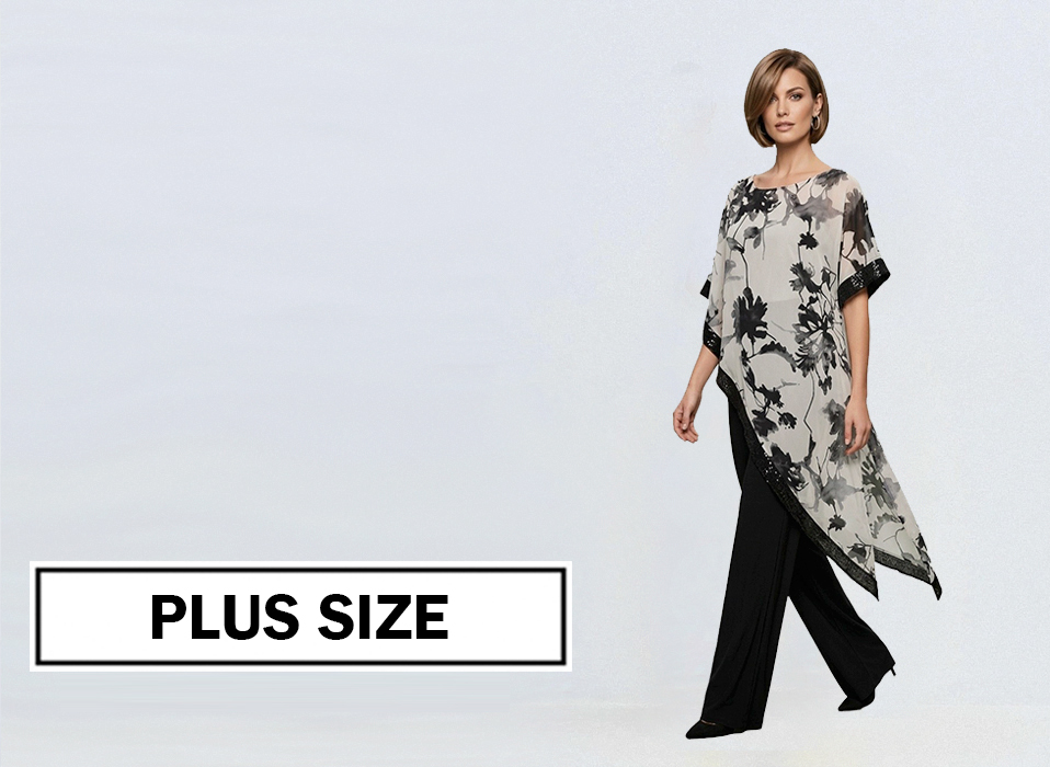 Plus size fashion ad model wears a monochrome floral poncho over black wide leg pants with a high low hem